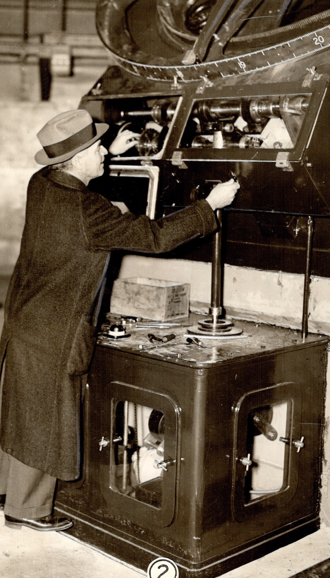 Reynold Kenneth Young (1886--1973) inspects the cl