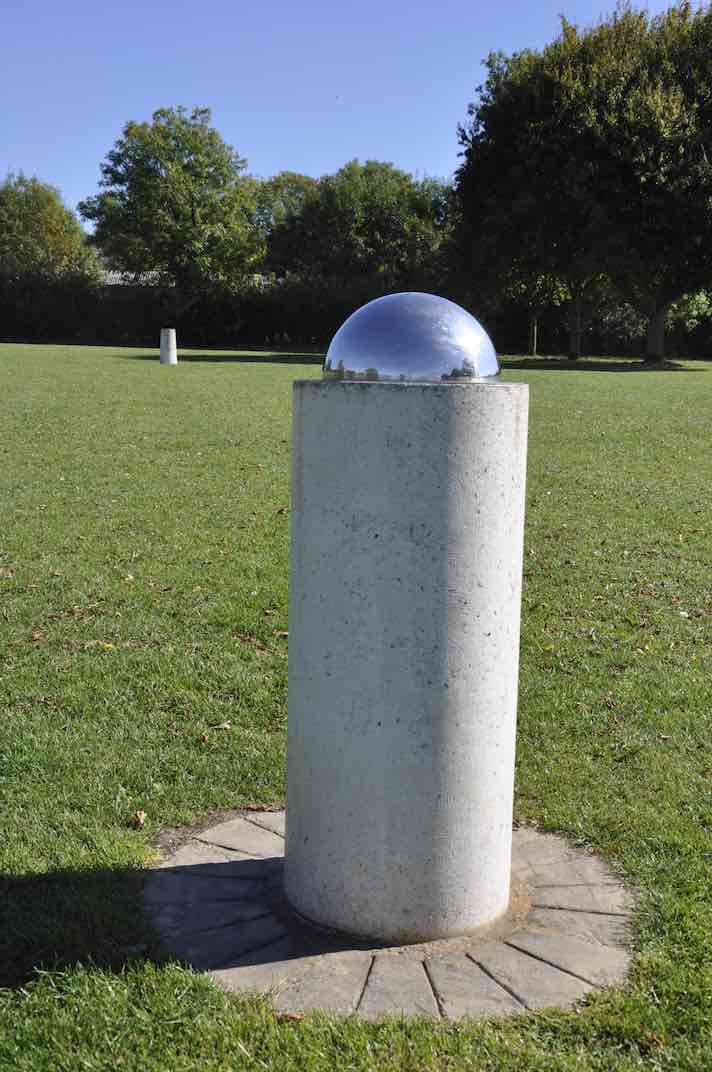 The Sun on its pillar with the Earth pillar behind